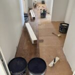 Rénovation de sol d’appartement et pose collée d’un parquet naturel huilé essence noyer sur sous-couche liège à Riedisheim près de Rixheim