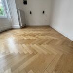 Rénovation par ponçage et vitrification de parquet massif vernis à Colmar Haut Rhin