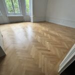 Rénovation par ponçage et vitrification de parquet massif vernis à Colmar Haut Rhin